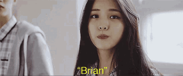 a girl with long hair is looking at the camera with the words " brian " on the bottom