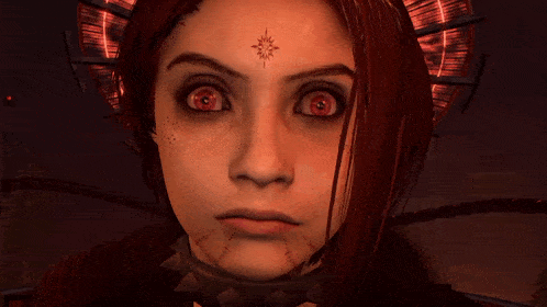 a close up of a woman 's face with a star on her forehead