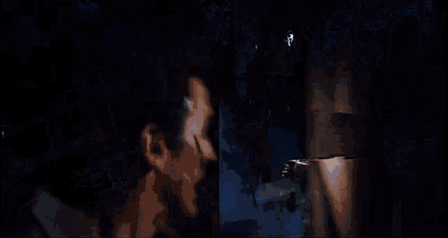 a man is standing in front of a fireworks display with a lot of sparks coming out of it