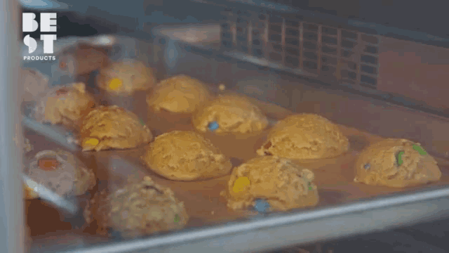 a bunch of cookies are being baked in an oven and the words be st products are visible