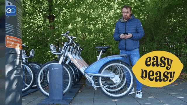 a man stands in front of a row of bicycles with a sign that says easy peasy