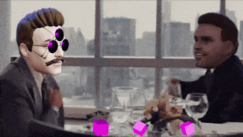 two men are sitting at a table with a purple cube in the middle