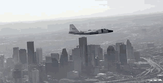 a nasa plane flies over a city