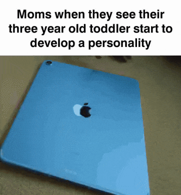 a blue apple ipad is sitting on a table with a meme written on it .
