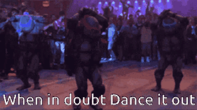 a ninja turtle dancing in front of a crowd with the words " when in doubt dance it out " below him