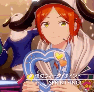a red haired anime character is holding a blue heart shaped object in his hands .