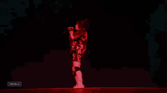 a woman singing into a microphone with a watermark that says gascolla