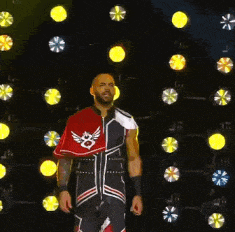 a wrestler in a red white and blue outfit with the number 8 on it