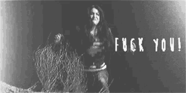 a black and white photo of a woman with the words " fuck you " above her