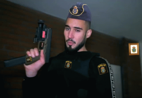 a man holding a gun with the word polis on his chest