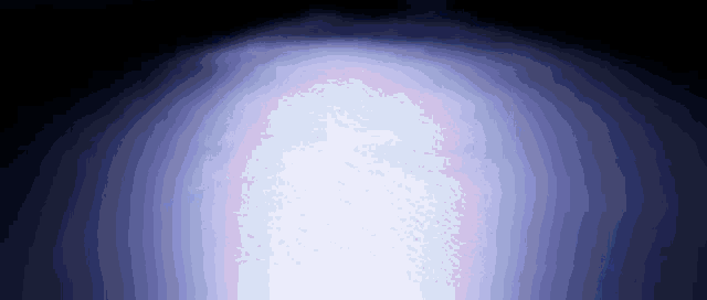 a blue light is shining on a black background