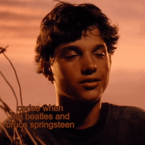 a close up of a boy 's face with the words cerise when the beatles and bruce springsteen