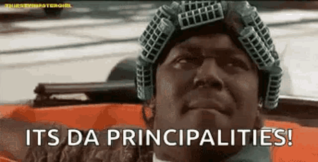 a man wearing a curlers on his head is sitting in a car .