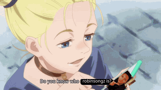 a girl is holding a picture of robinsongz