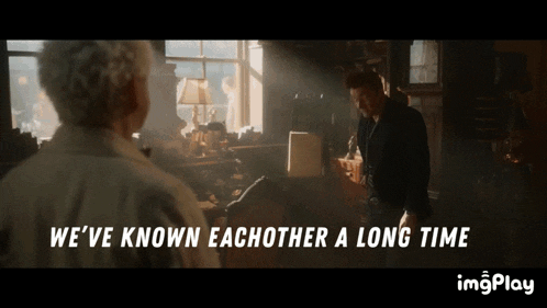 two men standing next to each other with the words we 've known eachother a long time behind them