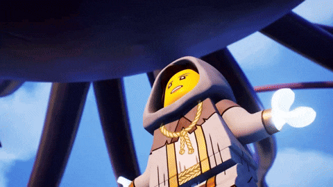 a lego figure with a hood on his head