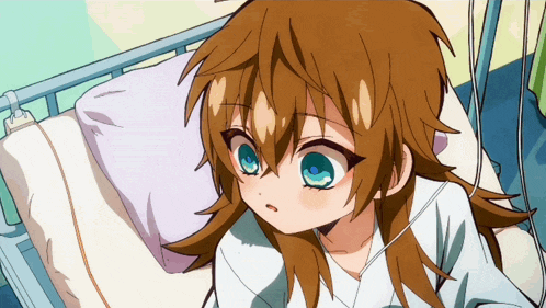 a girl with long brown hair and blue eyes is in a hospital bed