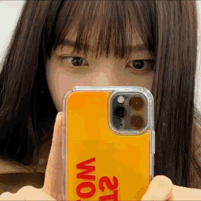 a girl is taking a picture of herself with a phone case that says 21