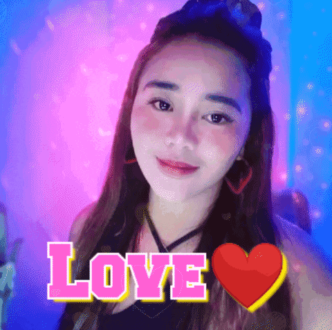 a woman with a red heart and the word love behind her