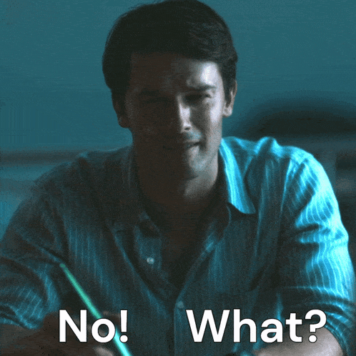 a man in a blue striped shirt says " no what "