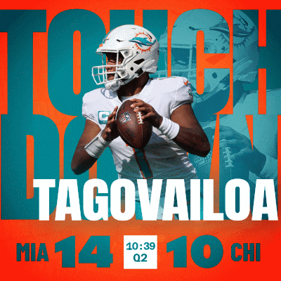 a miami dolphins football player is holding a football