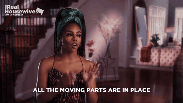 a woman in a leopard print top says all the moving parts are in place