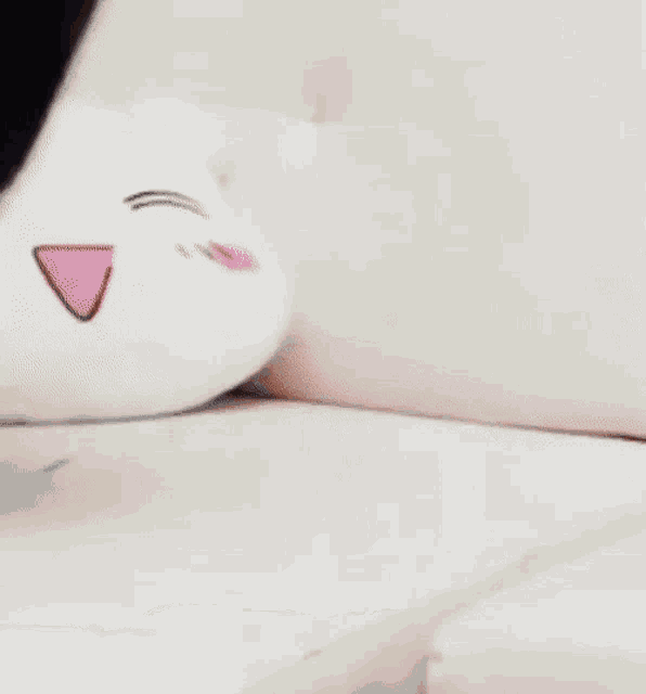 a woman is laying on her back on a bed and smiling