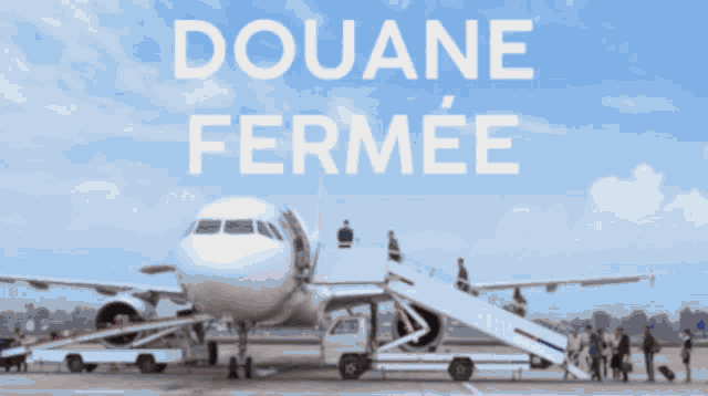 a sign that says douane fermee is above a plane