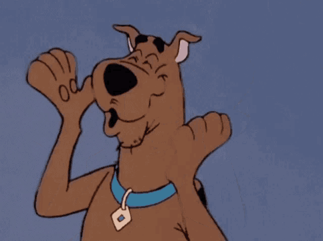 scooby doo is wearing a blue collar and giving a thumbs up