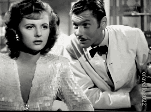 a black and white photo of a man and a woman taken by crawford 2002