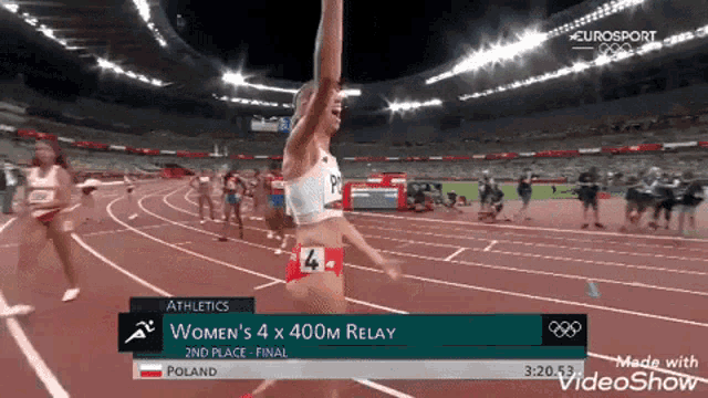 a woman is running on a track in the women 's 400m relay
