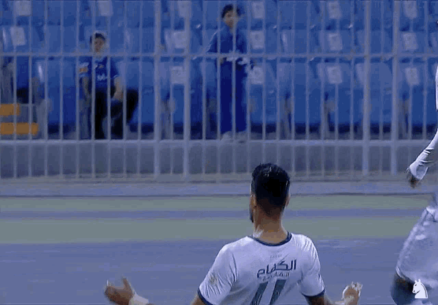 a soccer player with the number 11 on his shirt
