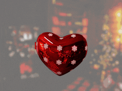 a heart shaped ornament with a picture of two anime characters inside