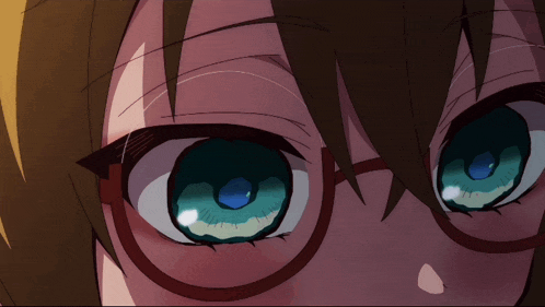 a close up of a person 's eyes with glasses on
