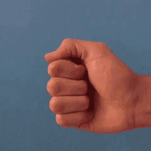 a close up of a person 's hand giving a thumbs up sign against a blue background .