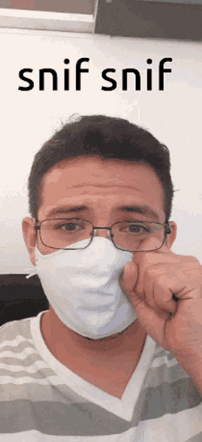 a man wearing glasses and a mask with the words snif snif behind him