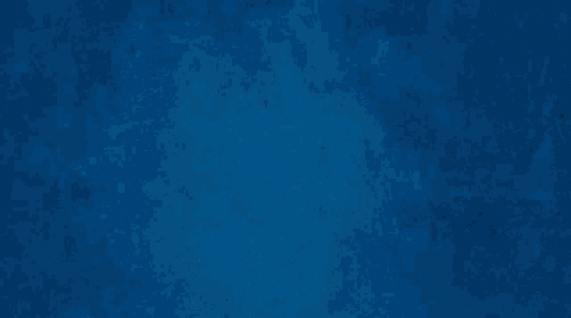 a blurry image of a person 's face with a blue background