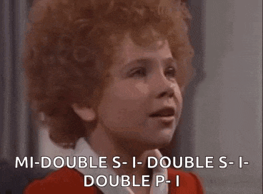 a little girl with red hair is smiling and saying `` mi-double s-i-double s-i double p-i ''