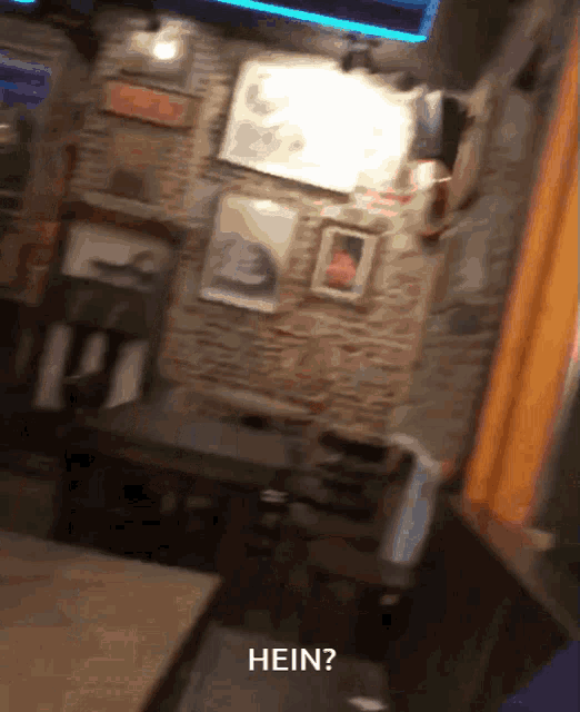 a blurry picture of a restaurant with the words hein written on the bottom