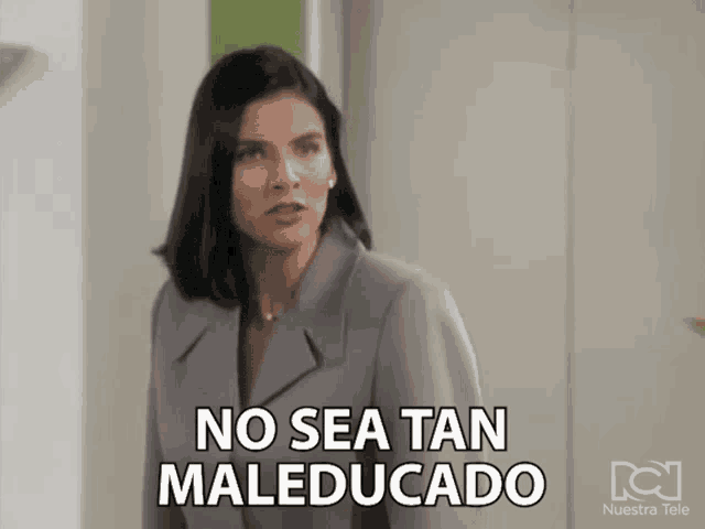 a woman in a suit says no sea tan maleducado in spanish