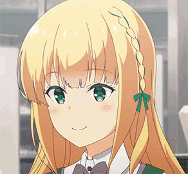 a girl with blonde hair and green eyes is smiling