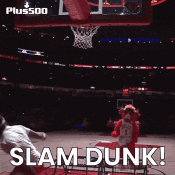 a bulls mascot stands in front of a basketball hoop with the words slam dunk on the bottom