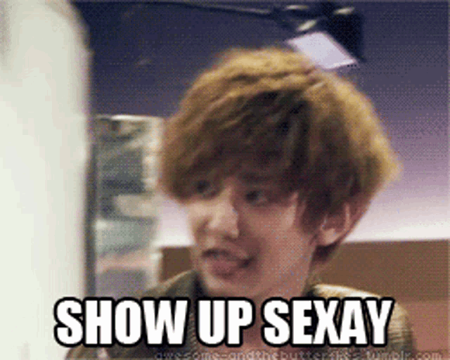 a young man is making a funny face with the words show up sexay above him
