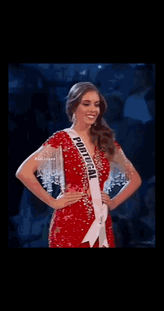 a woman wearing a sash that says portugal on it