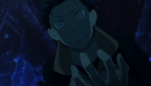 a man in a dark room with a hand on his chin