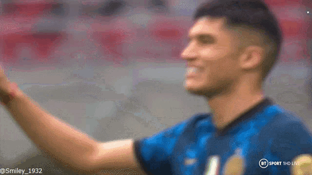 a blurry picture of a soccer player with the words bt sport hd live at the top