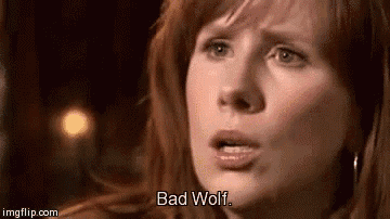 a close up of a woman 's face with the words `` bad wolf '' written on the bottom .