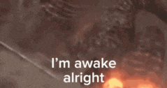 a picture of a monster with the words i 'm awake alright written on it