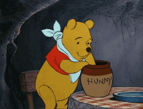 winnie the pooh is holding a pot of honey
