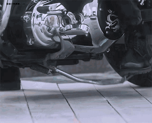 a black and white photo of a motorcycle with chinese characters on the bottom